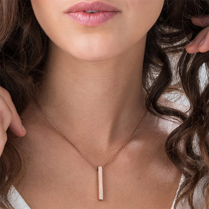 Woman wearing a dainty silver square bar pendant necklace with a polished stainless steel chain.