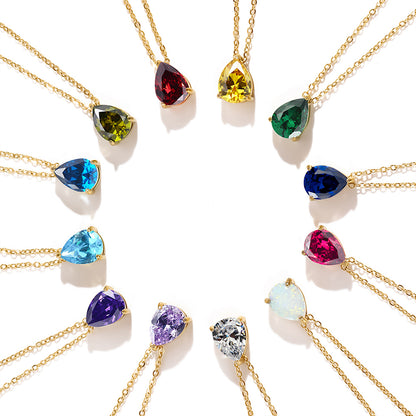 Multiple shiny crystal stainless steel birthstone pendant necklaces arranged in circle for display.