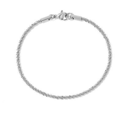 Adjustable silver stainless steel gypsophila bracelet with elegant shimmering texture, minimalist jewelry.