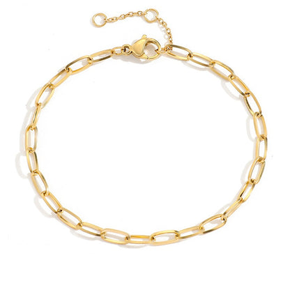 Adjustable gold stainless steel chain bracelet with elongated oval links isolated on white background.
