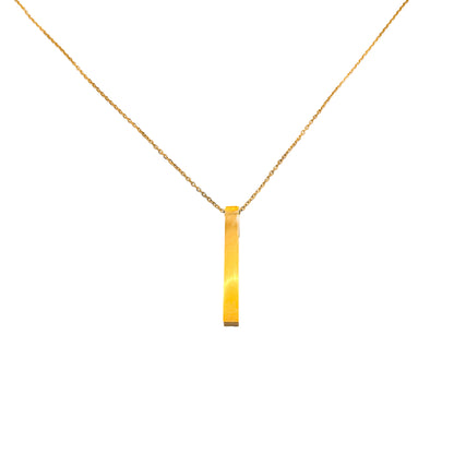 Simple gold square bar pendant necklace on a delicate stainless steel chain isolated on white background.
