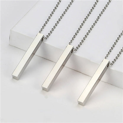 Three minimalist silver square bar stainless steel necklaces laid flat for a clean product display.