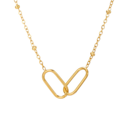 Gold infinity link stainless steel necklace with delicate chain isolated on clean white background.